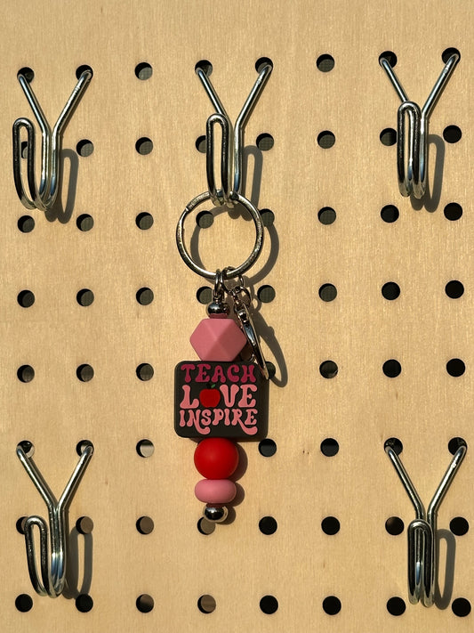 “Teach L🍎ve Inspire” - Mini Keychain